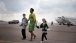First Lady Michelle Obama Walks Across the Tarmac