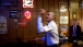 President Barack Obama throws darts at Manuel's Tavern