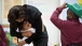 First Lady Michelle Obama Hugs A Student