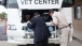 Secretary Shinseki Checks Under the Hood of a Mobile Vet Center