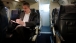 Secretary of Education Arne Duncan Works During A Commercial Flight