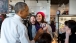 President Obama Looks At A Selfie With Restaurant Staff 