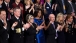 First Lady Michelle Obama And Guests Applaud