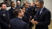President Obama Is Presented A Challenge Coin By An Emergency Responder