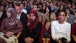 People Listen As The President Delivers Remarks
