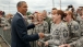 President Barack Obama Jokes With Military Personnel