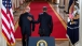 President Barack Obama walks down the Cross Hall with Vice President Joe Biden