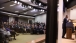 Audience Is Reflected In Glass As President Obama Speaks