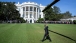The President waves after arriving aboard Marine One