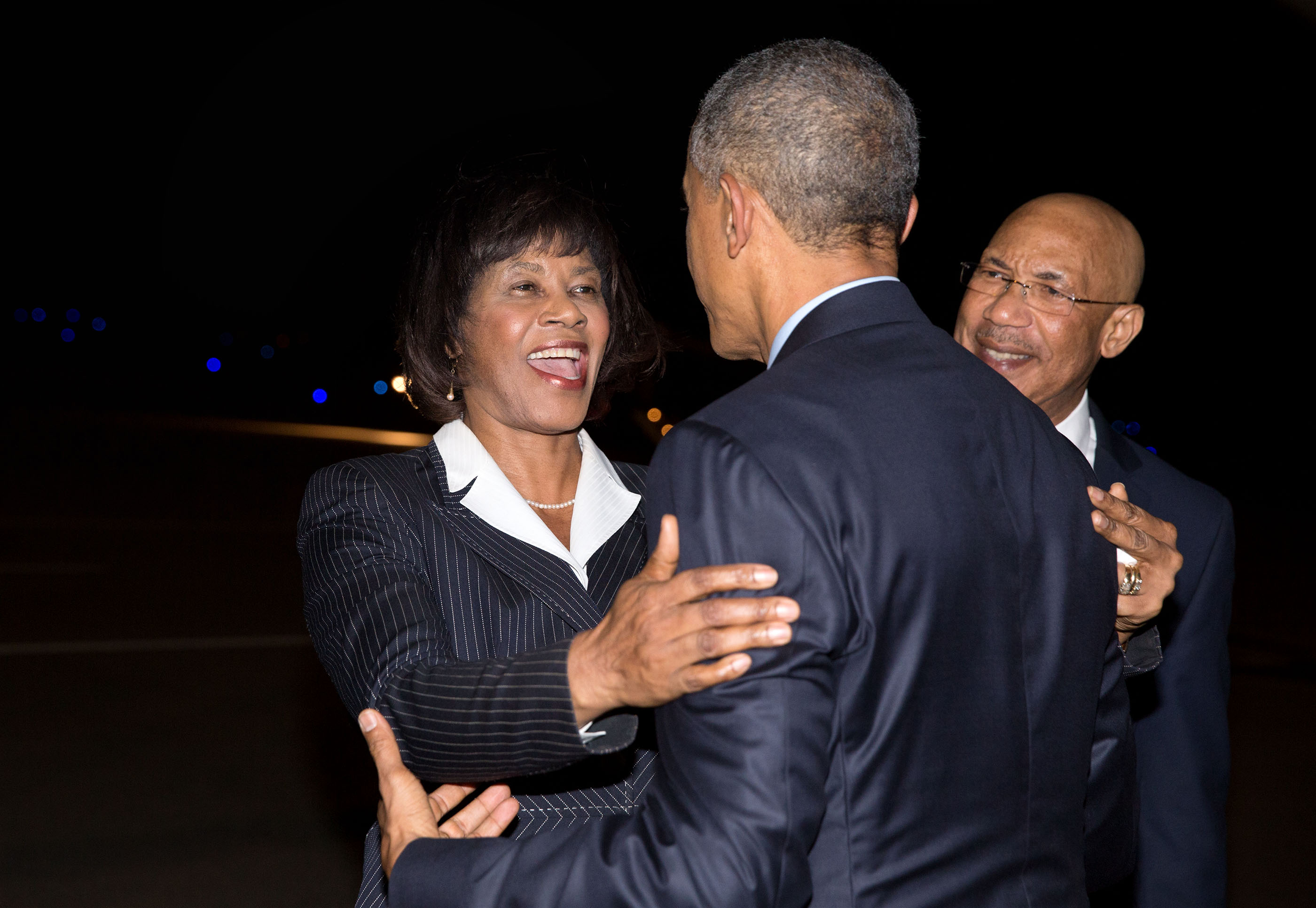 Prime Minister Portia Simpson Miller of Jamaica and Sir Patrick Allen, Governor-General, greet President Obama upon arrival in Kingston, Jamaica. (Official White House Photo by Pete Souza)