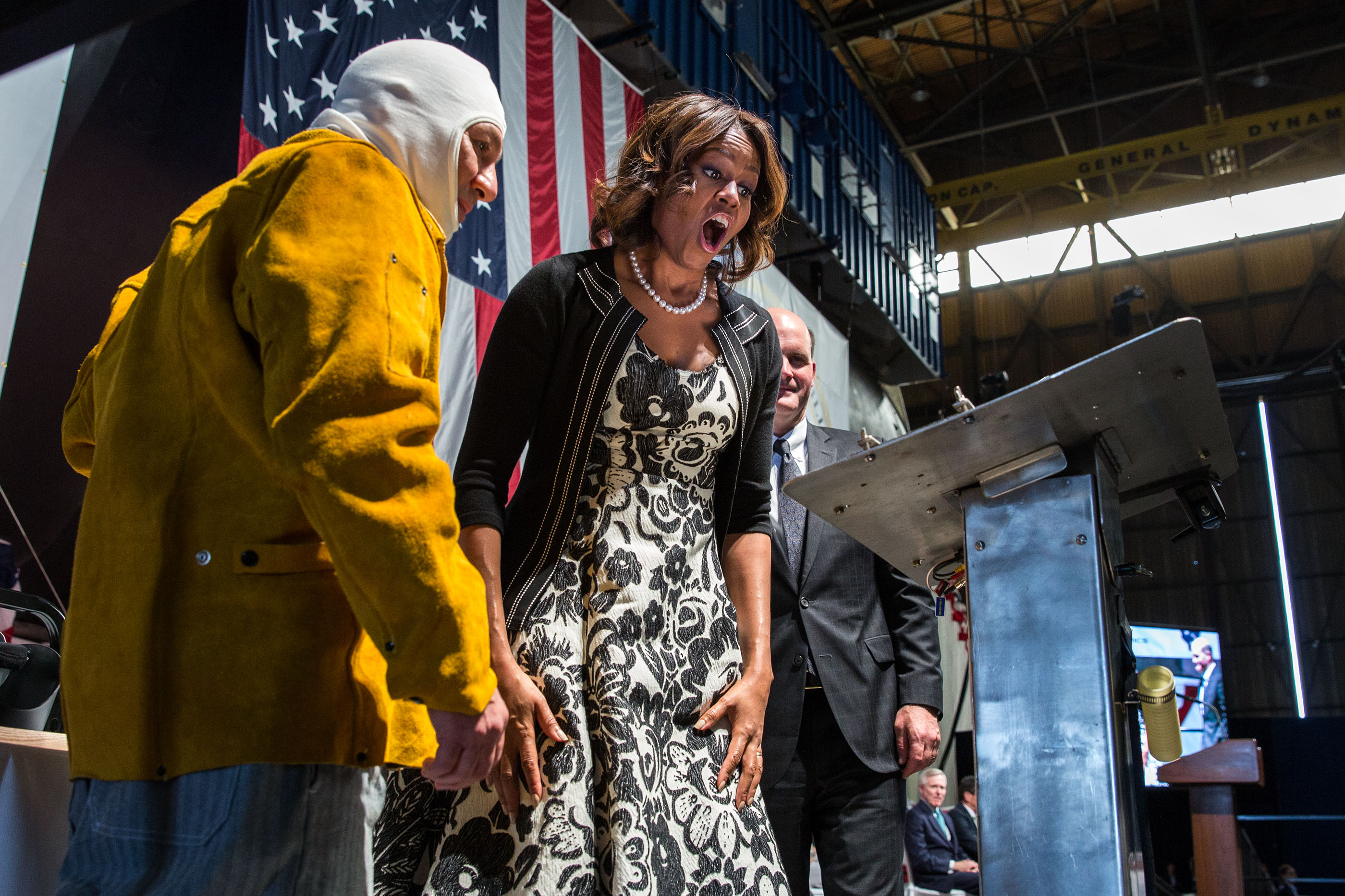 The First Lady reacts to seeing her initials welded onto a steel plate during a keel-laying ceremony for the USS Illinois in North Kingston, R.I., June 2, 2014. (Official White House Photo by Chuck Kennedy)