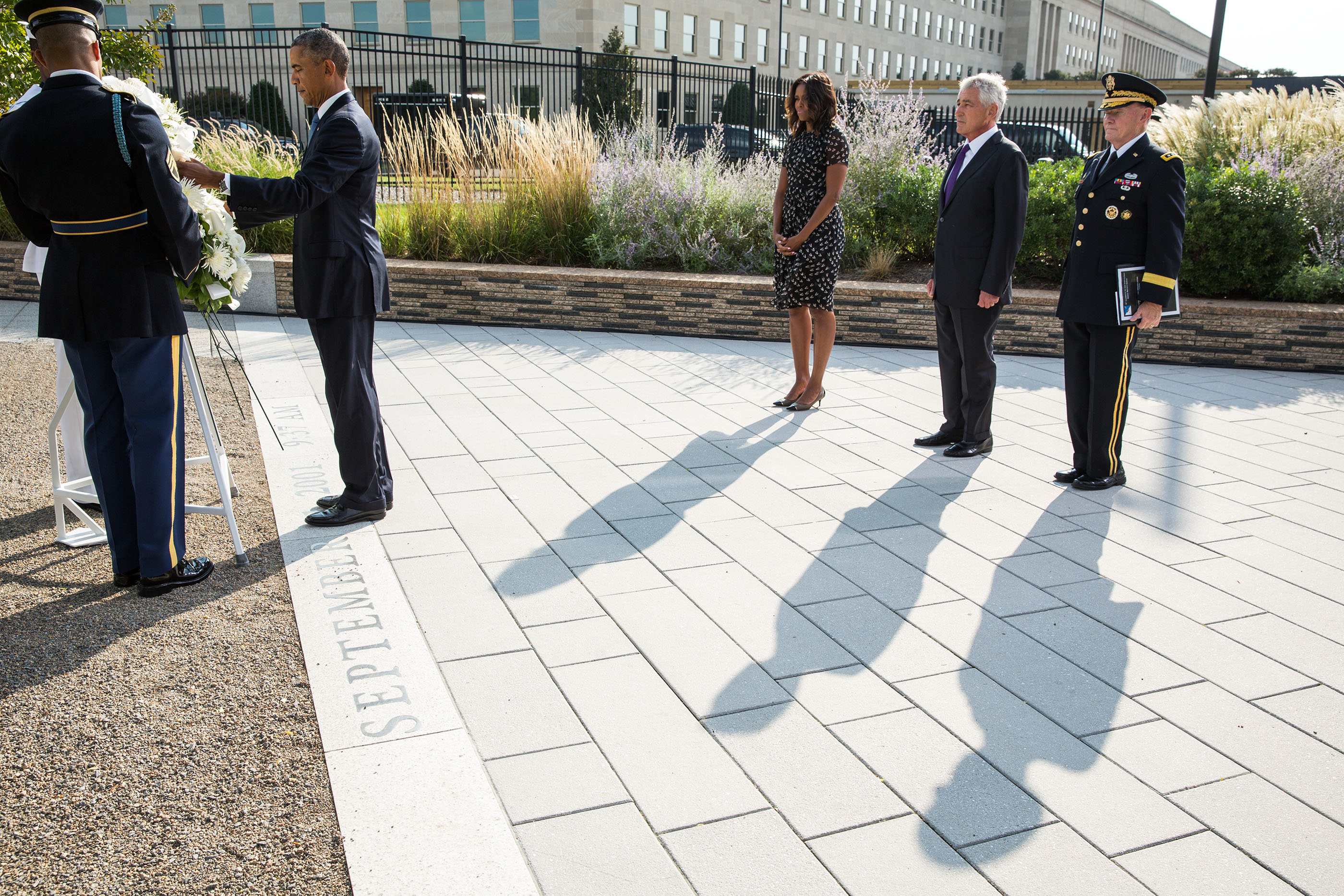 The President and First Lady participate in a wreath ceremony with Sec. Hagel, and Gen. Dempsey at the Pentagon Memorial in Arlington, Va., Sept. 11, 2014. (Official White House Photo by Pete Souza)