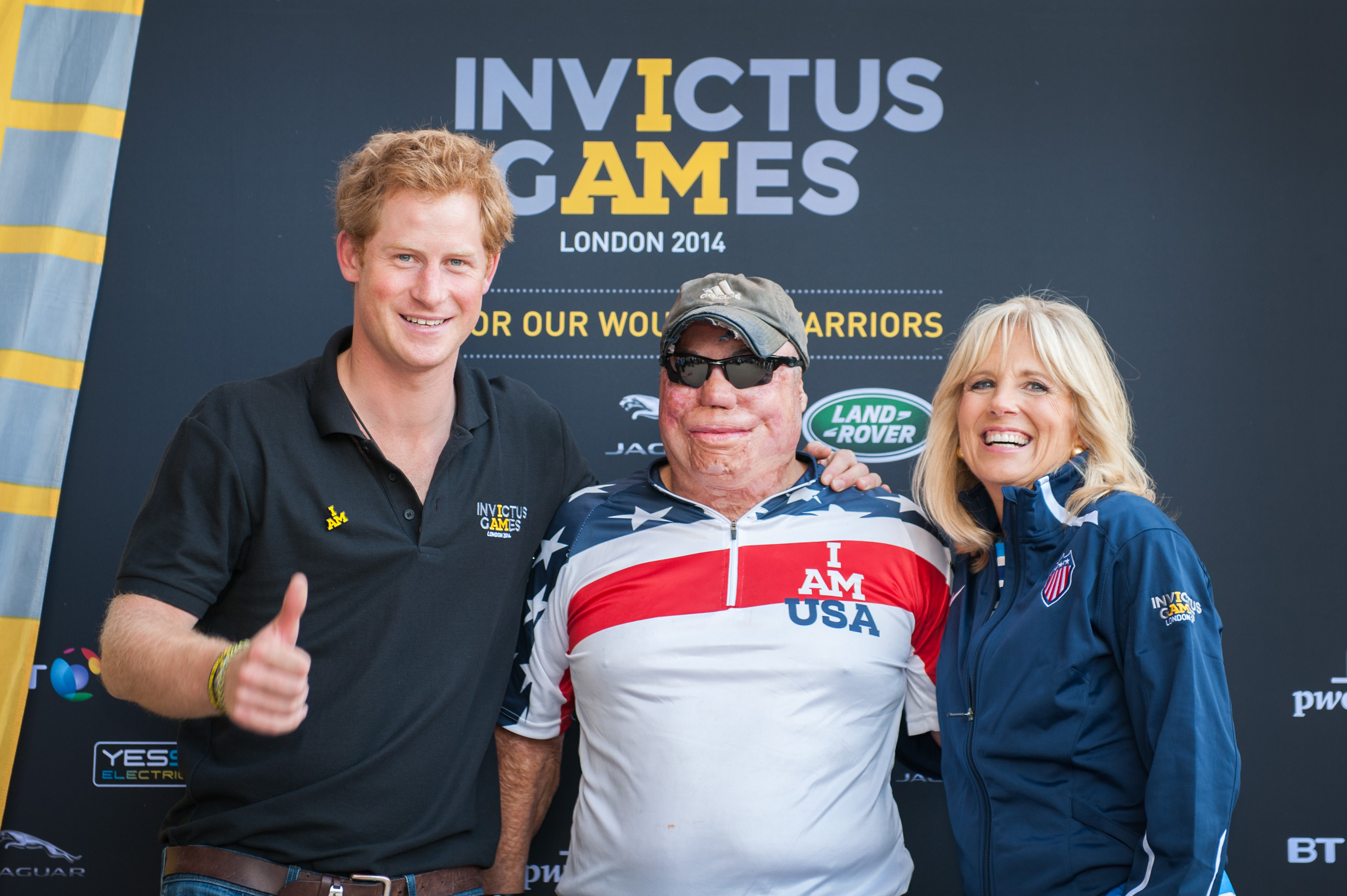 Dr. Jill Biden and Prince Harry congratulate a US Team athlete after a road cycling event at the Invictus Games in London, UK, September 13, 2014. (Photo by James Pan, State Department)