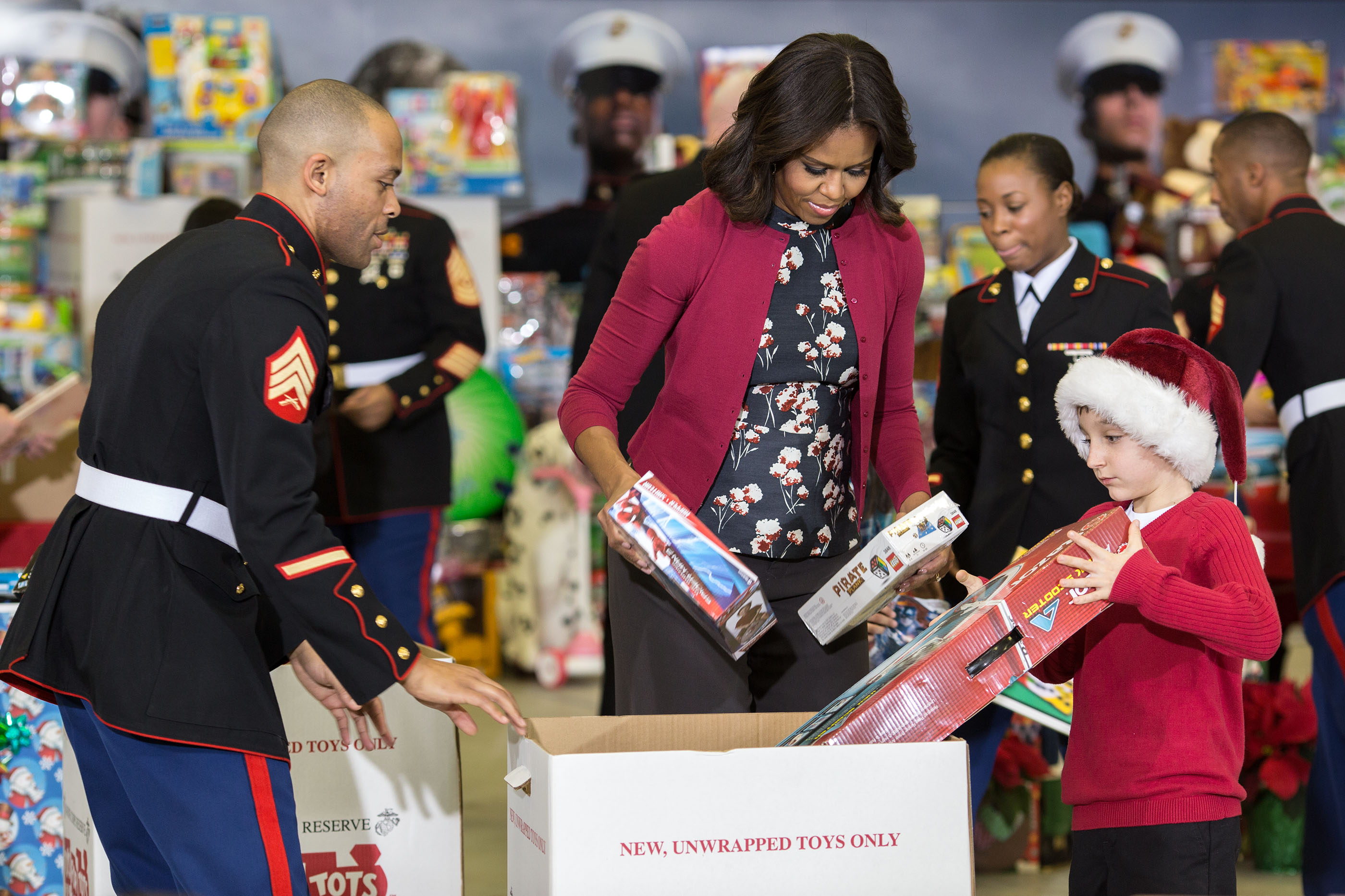 The  First Lady sorts toys during the Toys for Tots event at Joint Base Anacostia-Bolling Dec. 10, 2014. (Official White House Photo by Pete Souza)