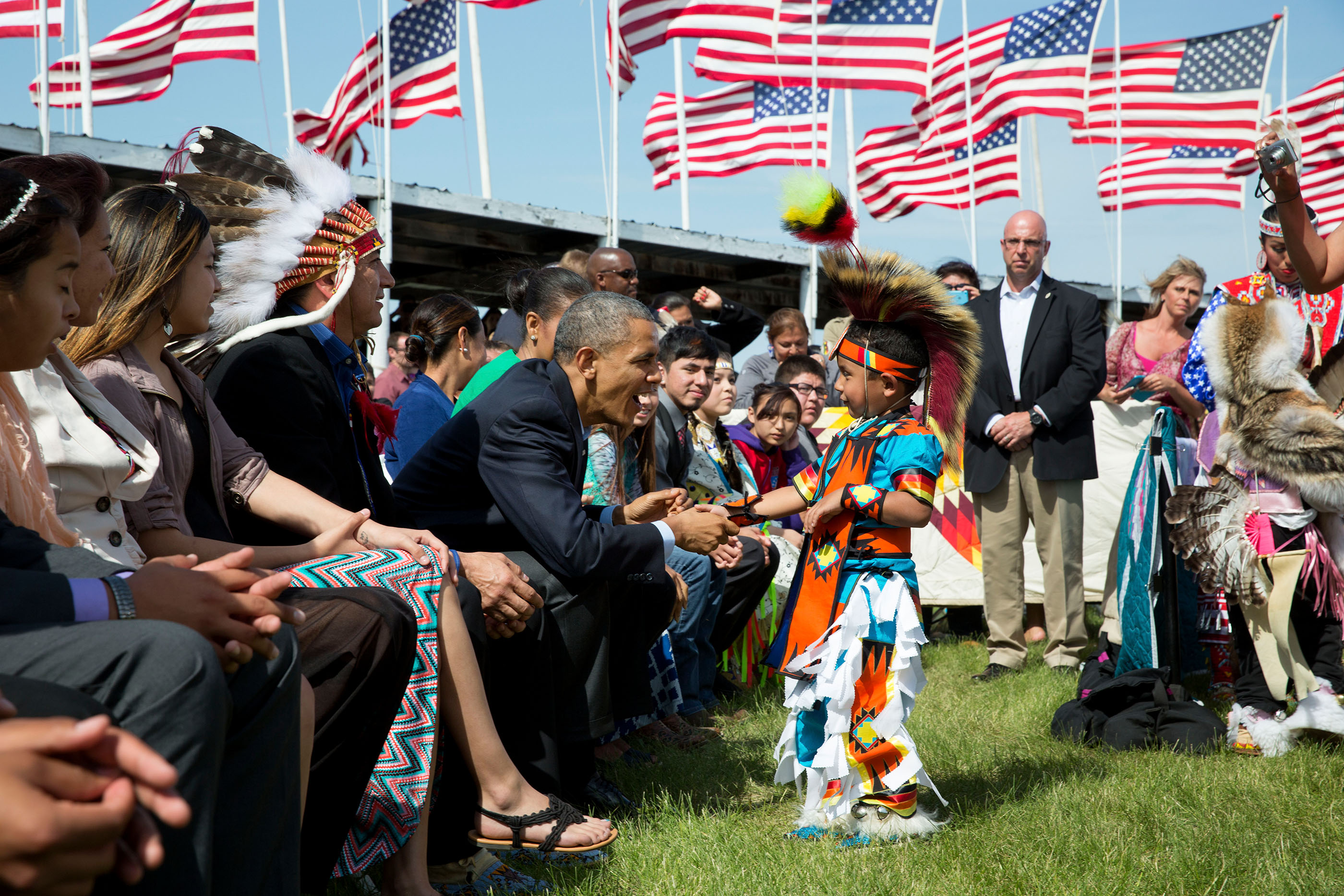 North Dakota, June 13, 2014. Greeting a young boy during a Flag Day celebration at the Standing Rock Sioux Tribe Reservation in Cannon Ball. (Official White House Photo by Pete Souza)