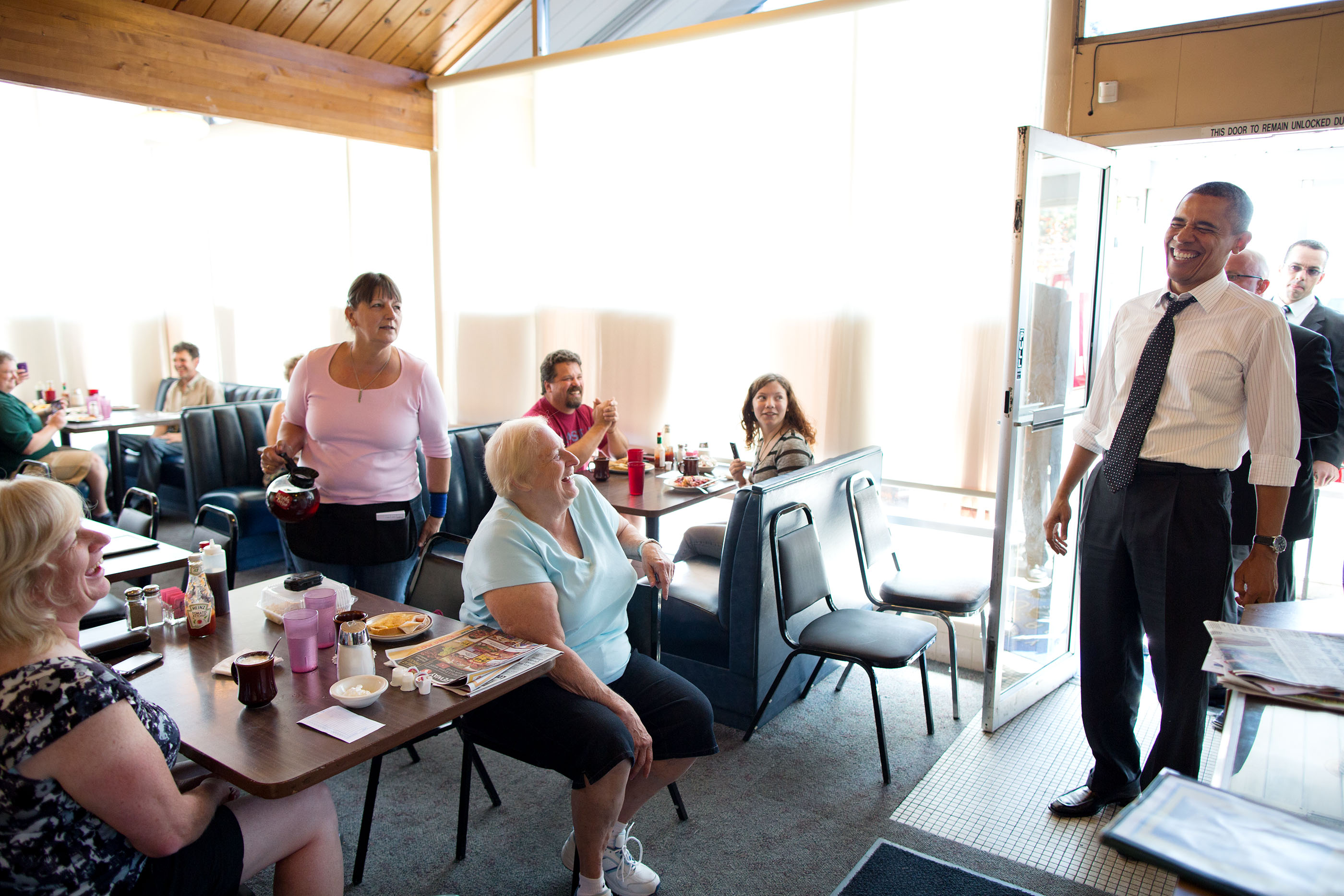 Oregon, July 24, 2012. Reacting to a quip from a patron at the Gateway Breakfast House in Portland. (Official White House Photo by Pete Souza)