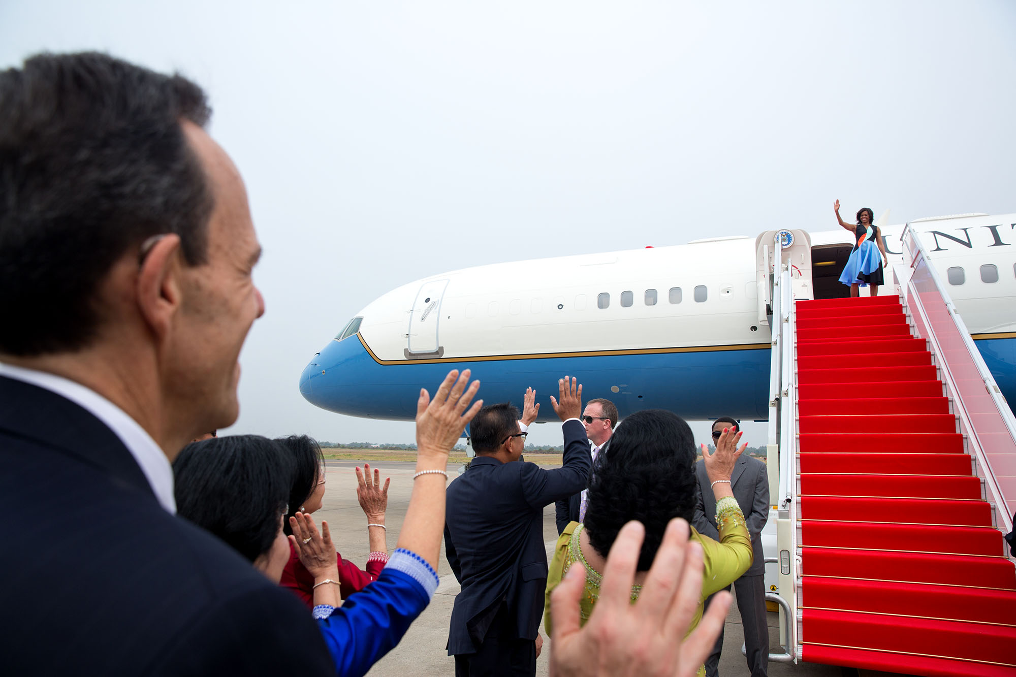 The First Lady waves prior to departure from Siem Reap, Cambodia. (Official White House Photo by Amanda Lucidon)