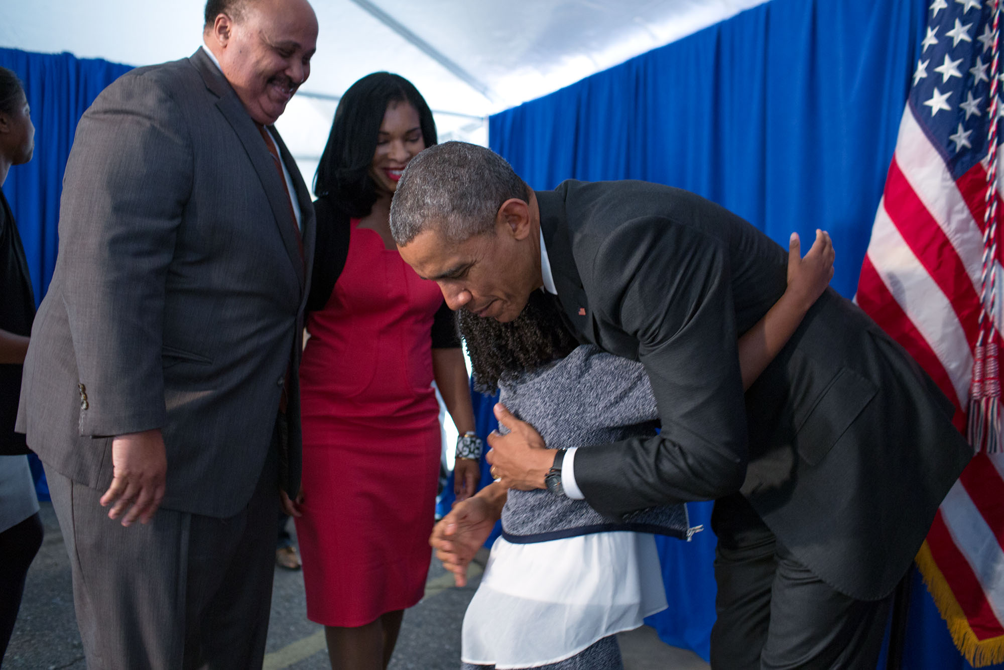 The President hugs Yolanda Renee King, granddaughter of Martin Luther King, Jr., as her parents, Martin Luther King III and Andrea Waters look on. (Official White House Photo by Pete Souza)
