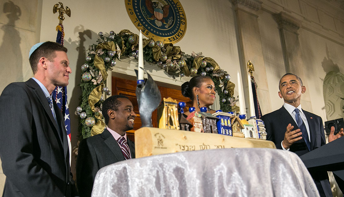 President Barack Obama, with First Lady Michelle Obama, Dr. Adam Levine and Ataklit Tesfaye, delivers remarks during Hanukkah reception #2 in the Grand Foyer of the White House, Dec. 17, 2014. (Official White House Photo by Amanda Lucidon)