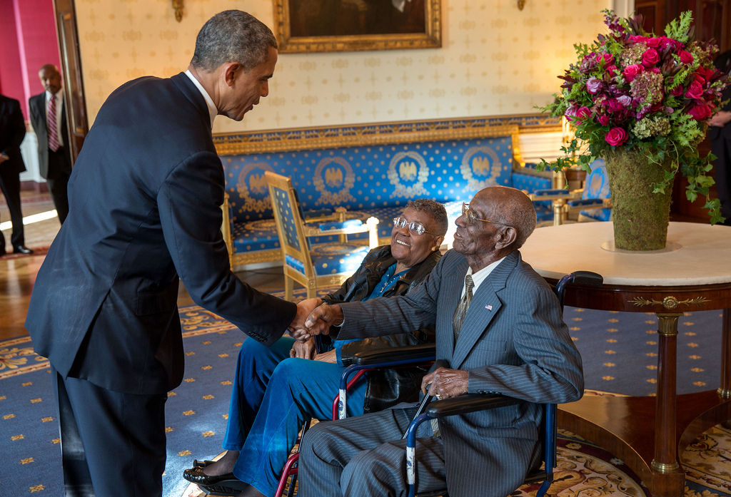 President Barack Obama greets Richard Overton, with Earlene Love-Karo, in the Blue Room of the White House.