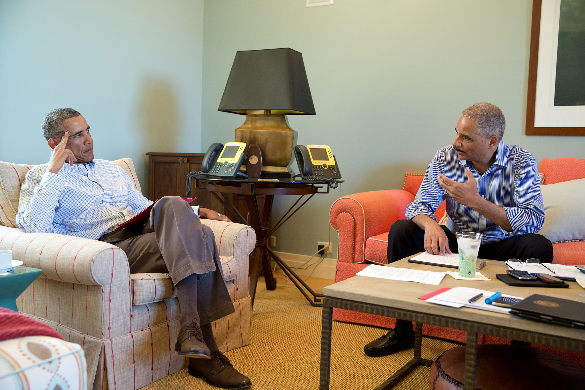President Obama talks with Attorney General Eric Holder to discuss the situation in Ferguson, Missouri