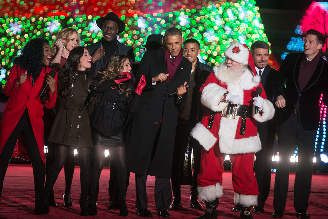 President Obama dances on stage during the National Christmas Tree lighting