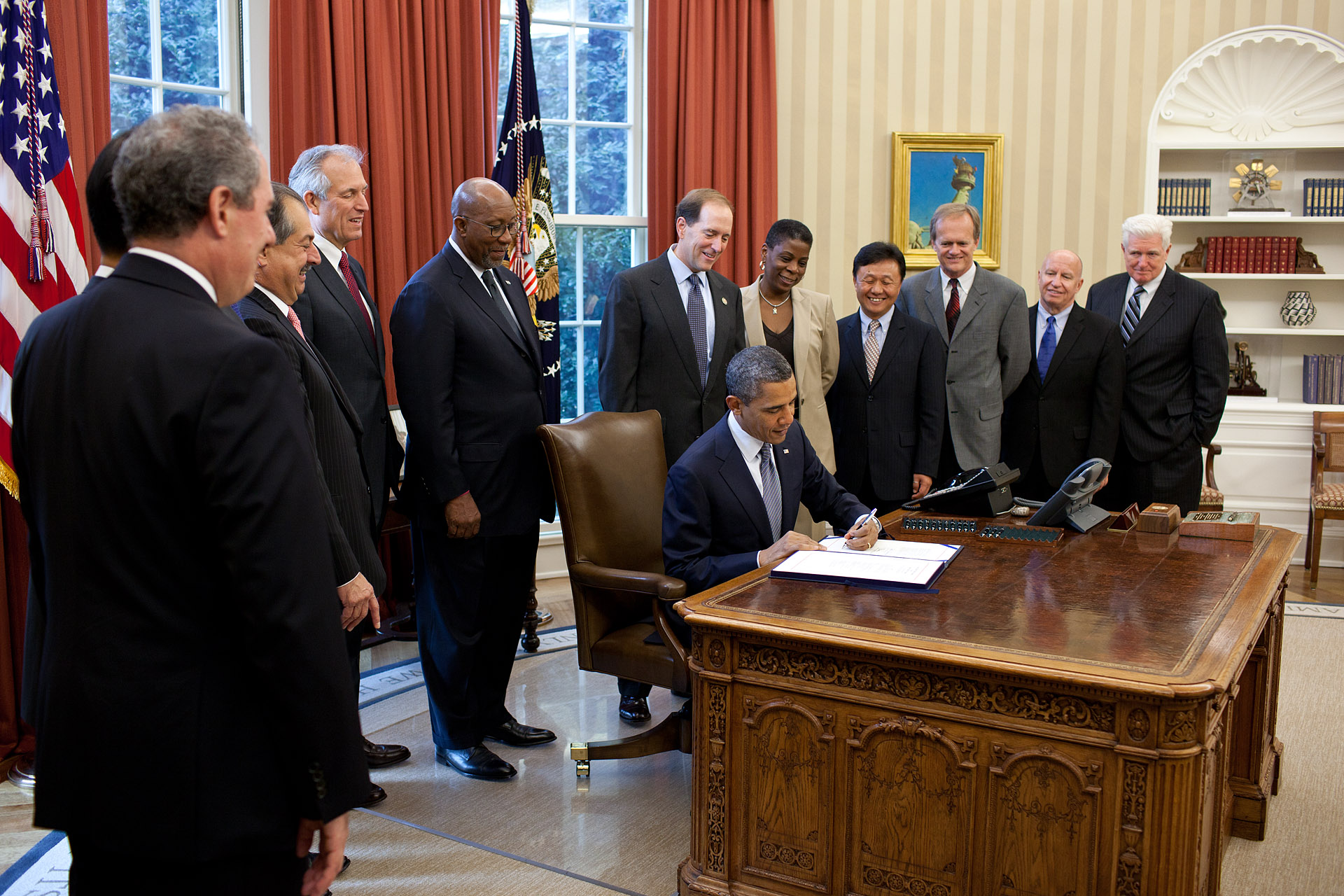 President Barack Obama signs the United States-Korea Free Trade Agreement Implementation Act