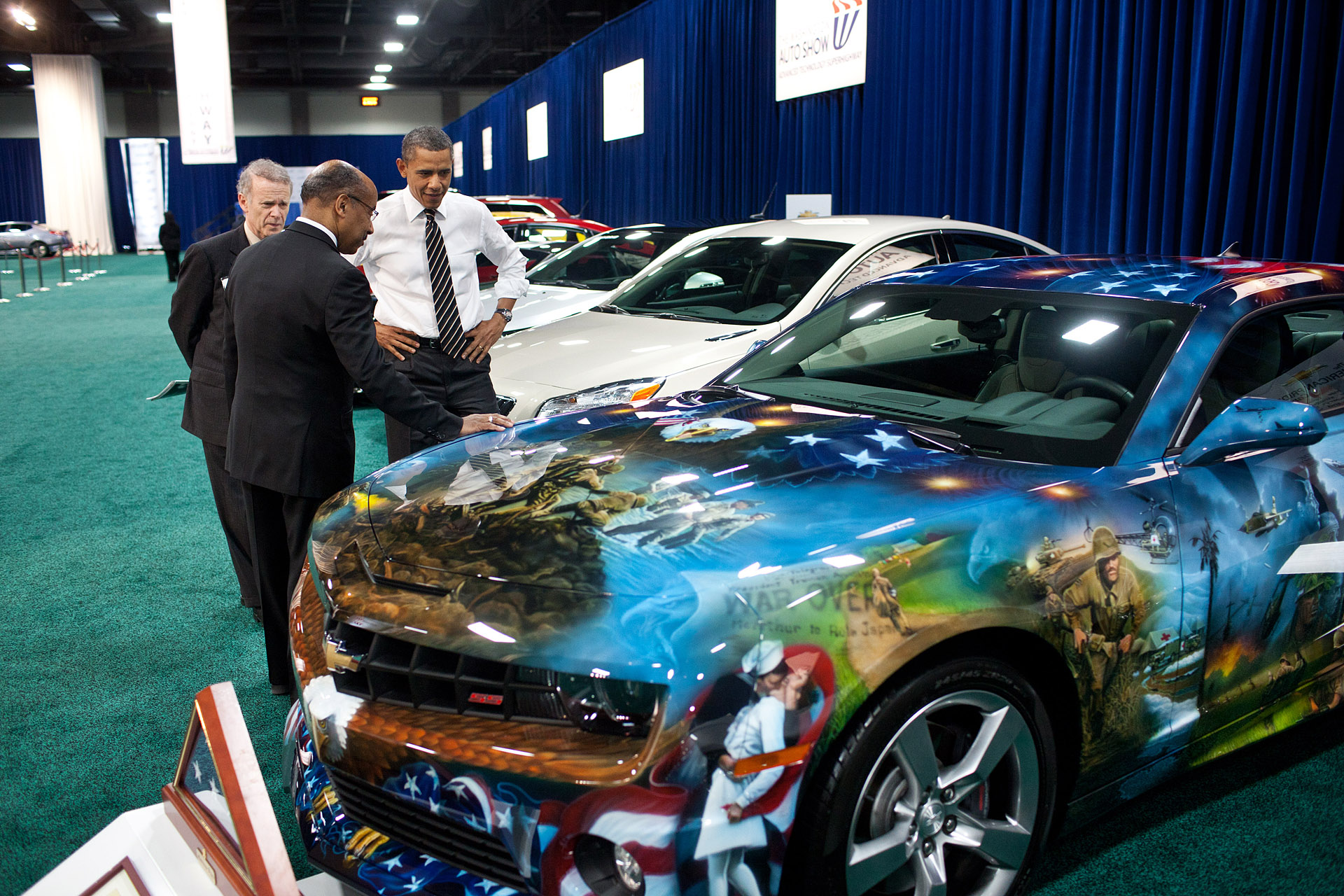 President Barack Obama is shown the American Pride Chevrolet Camaro (January 31, 2012)