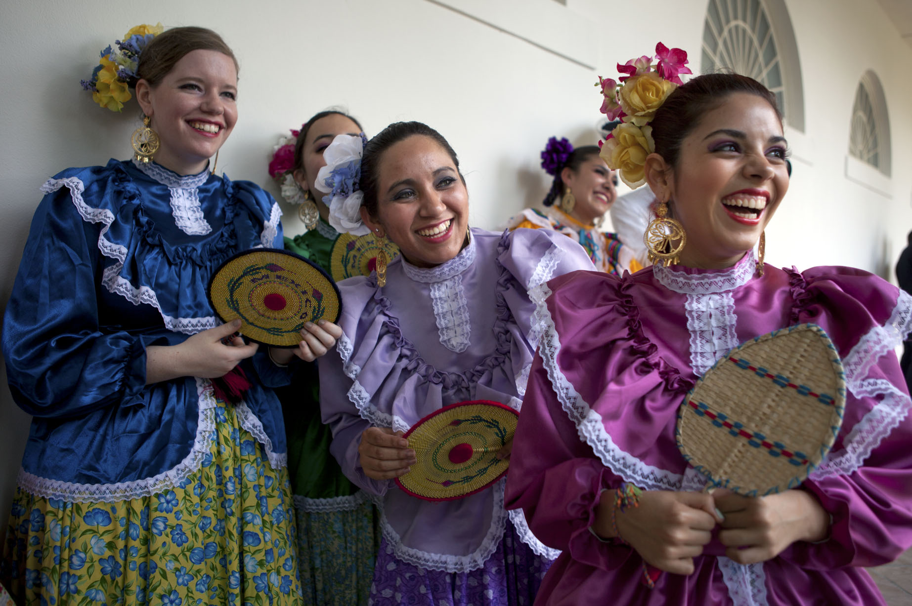 Dancers watch as President Barack Obama delivers remarks at a Cinco de Mayo event (May 4, 2012)
