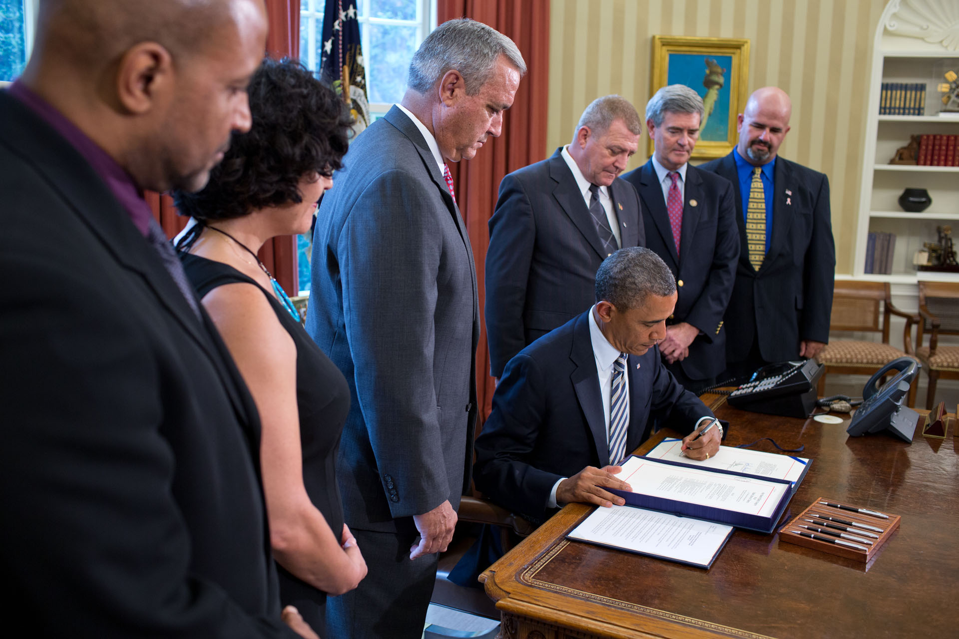 President Barack Obama signs H.R. 1627 (August 6, 2012)
