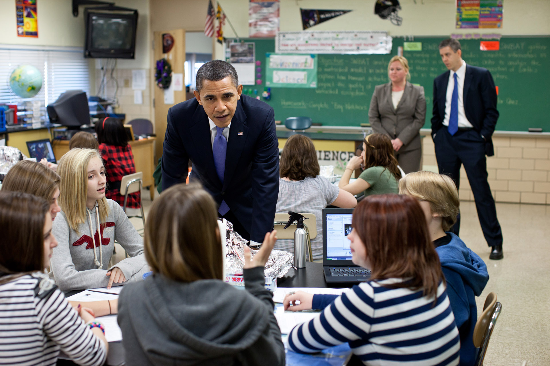 President Barack Obama, with science teacher Susan Yoder and Education Secretary Arne Duncan at Parkville Middle School and Center of Technology 