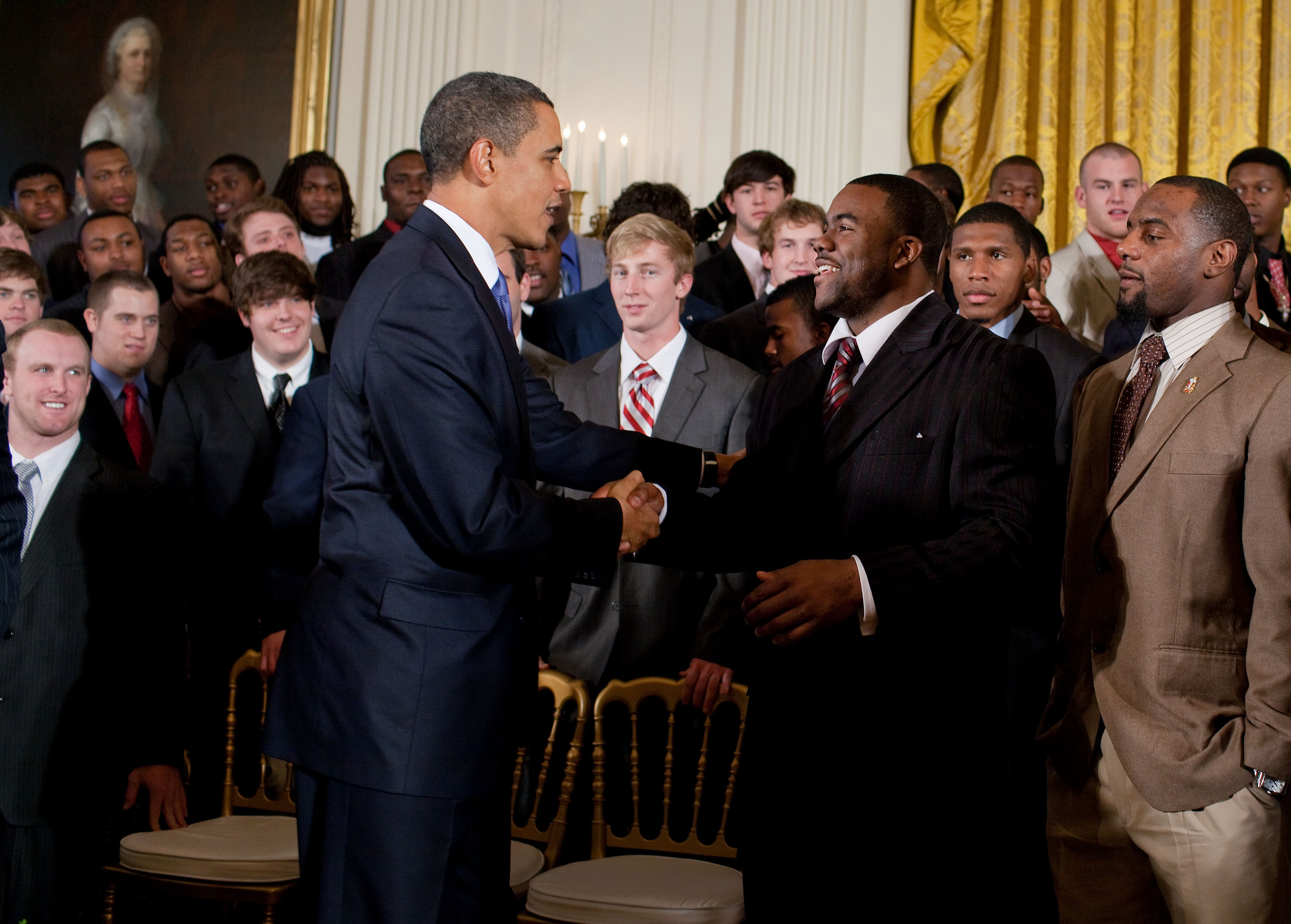 President Barack Obama shakes hands with University of Alabama running back Mark Ingram