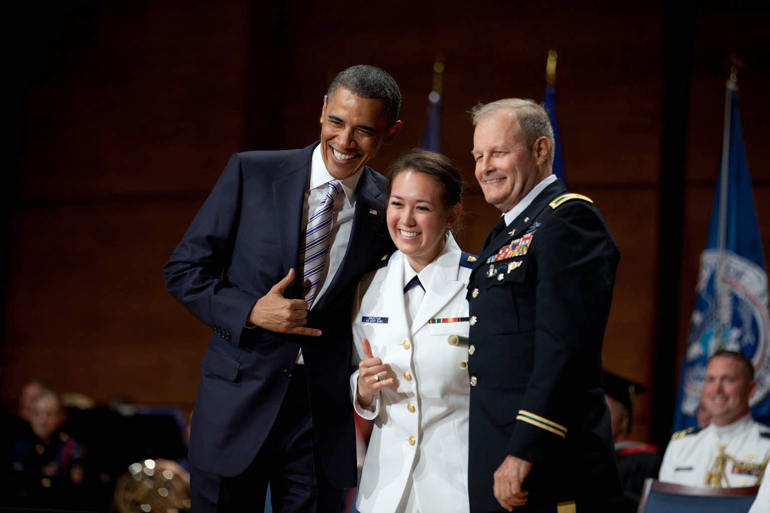President Barack Obama and Ensign Jennifer Proctor make the 'shaka' sign