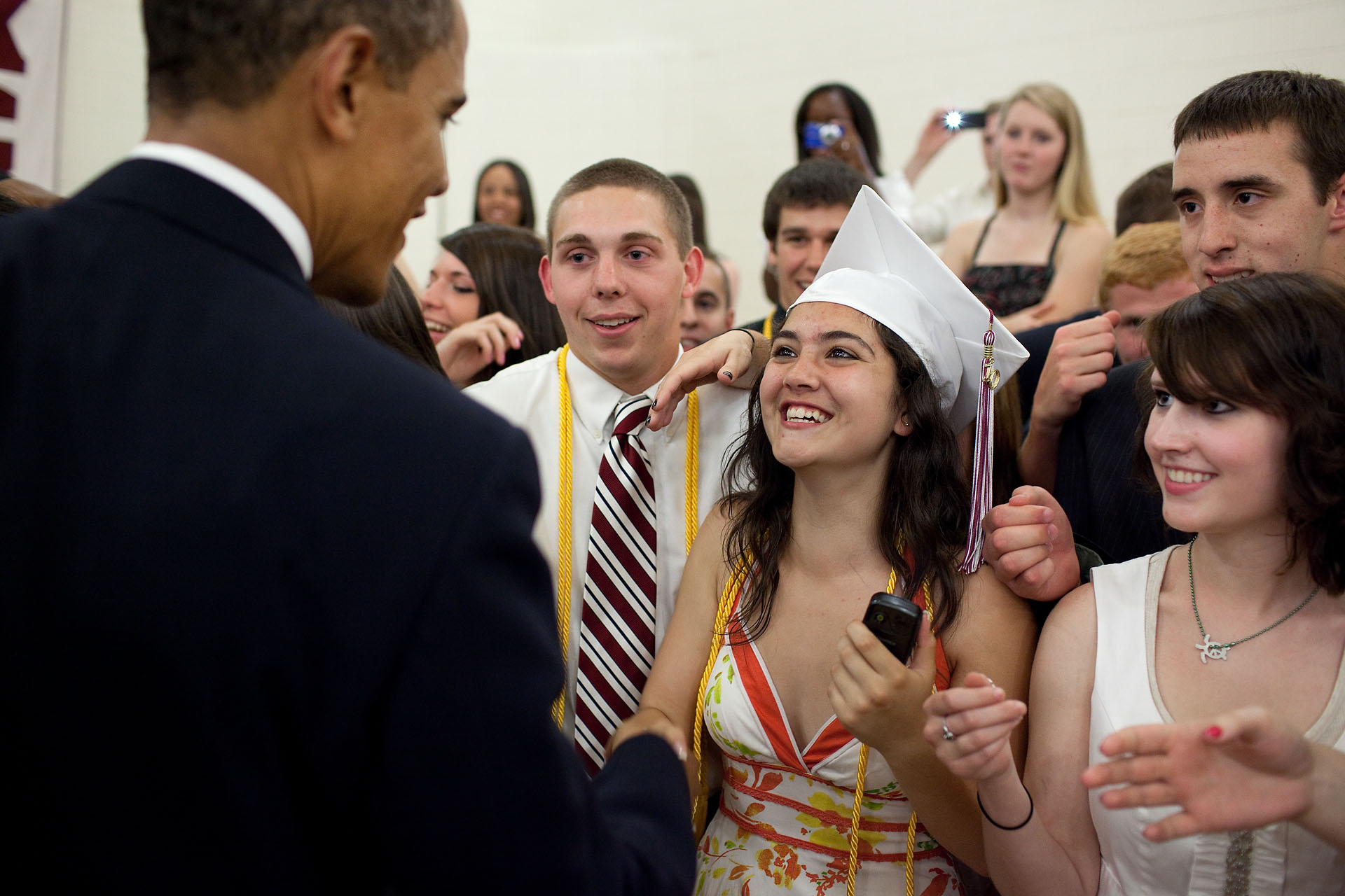 President Barack Obama greets and shakes hands  with the graduating class of Kalamazoo Central High School