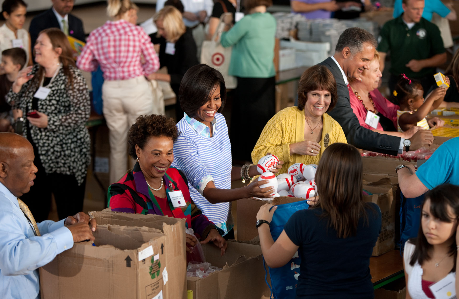 First Lady Michelle Obama helps fill care packages during a Congressional Service