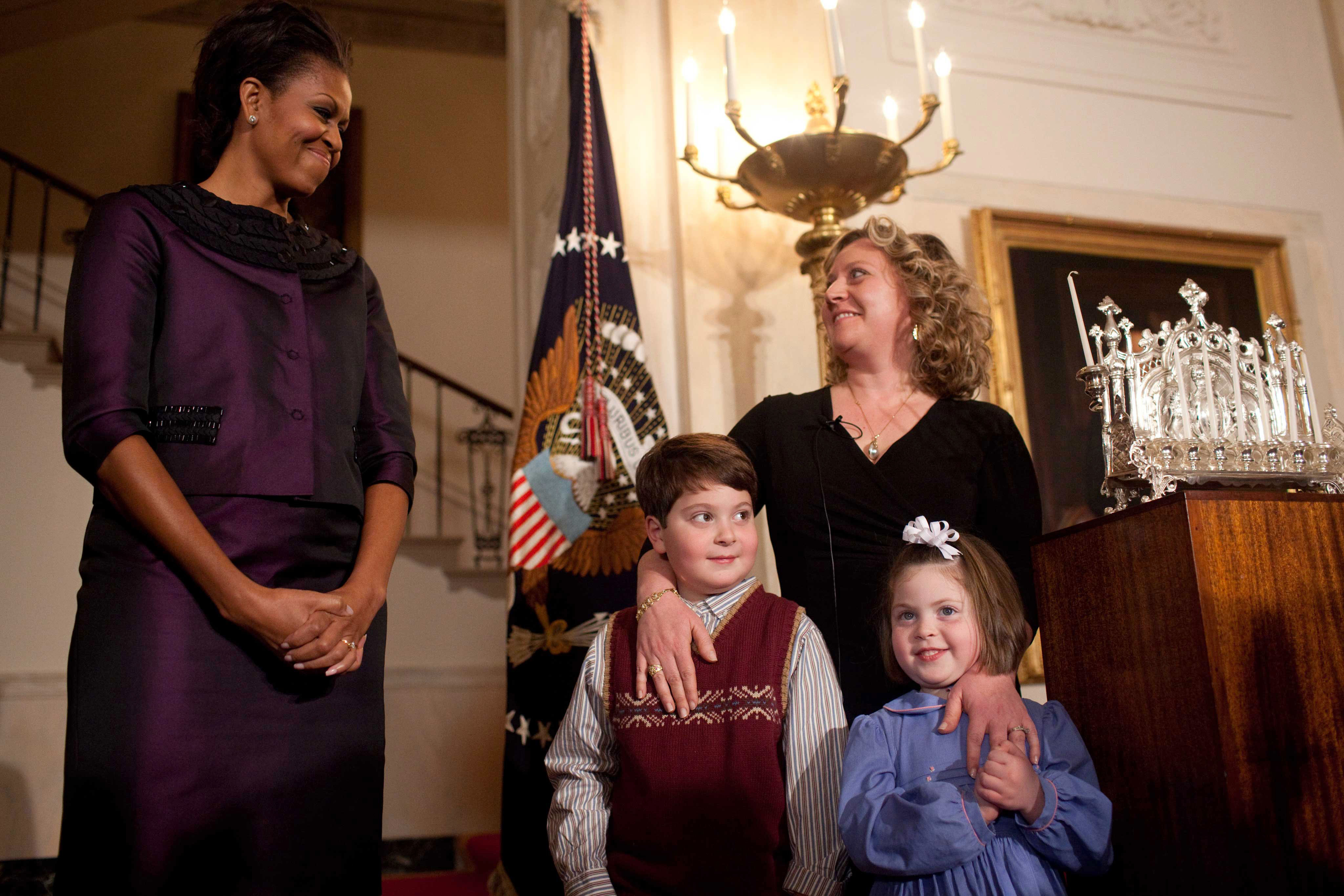 First Lady Michelle Obama stands with Alison Buckholtz and her children at Hanukkah Reception