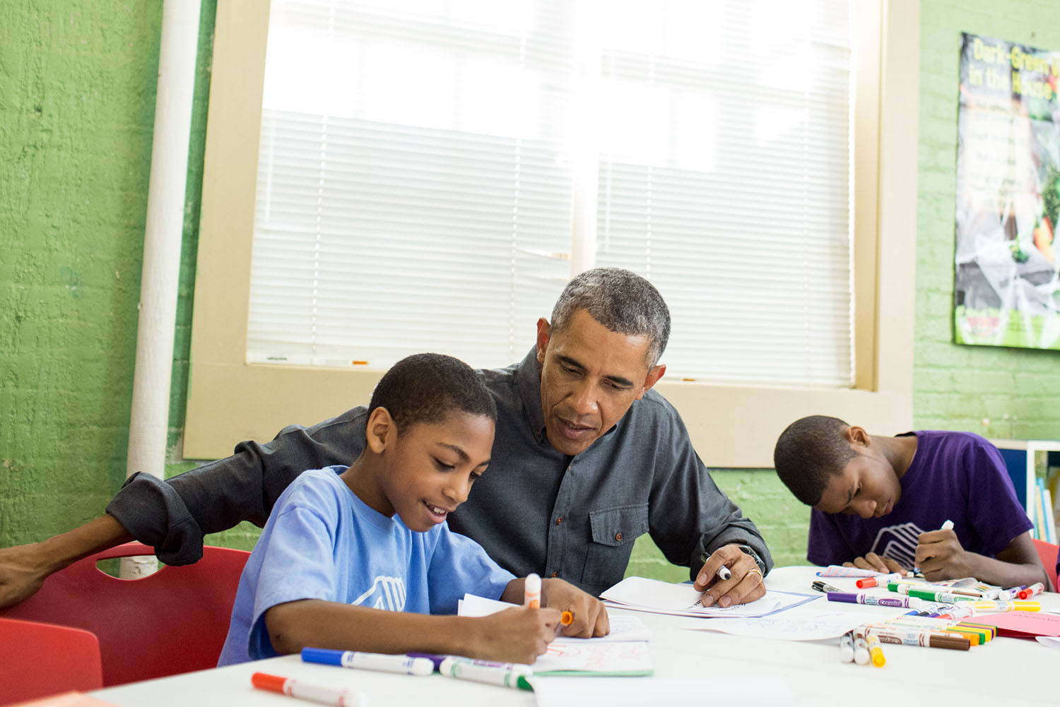 President Obama works with young boys during a community service project at the Boys & Girls Club of Greater Washington