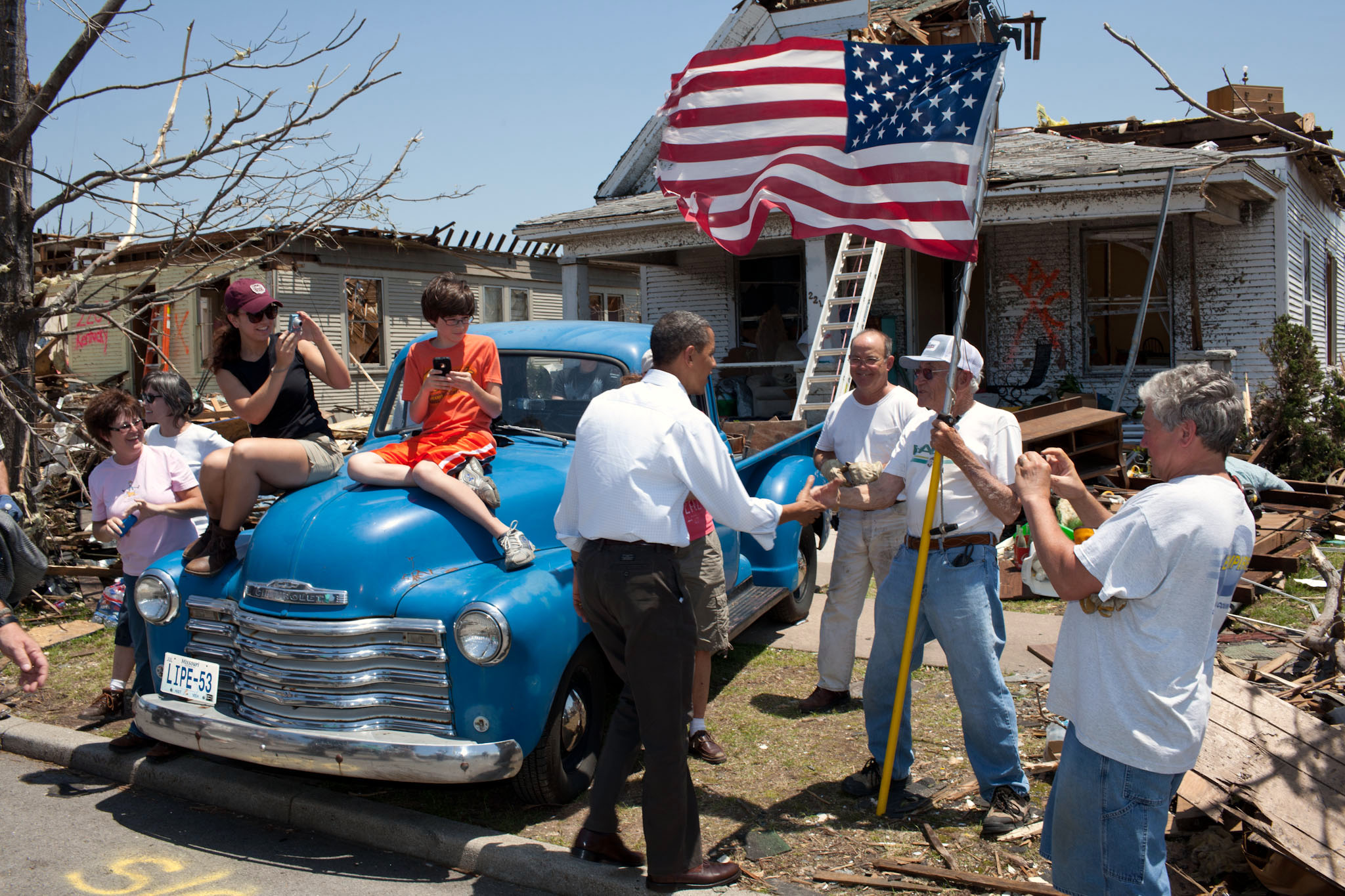 President Barack Obama Greets Hugh Hills In Front Of His Home In Joplin