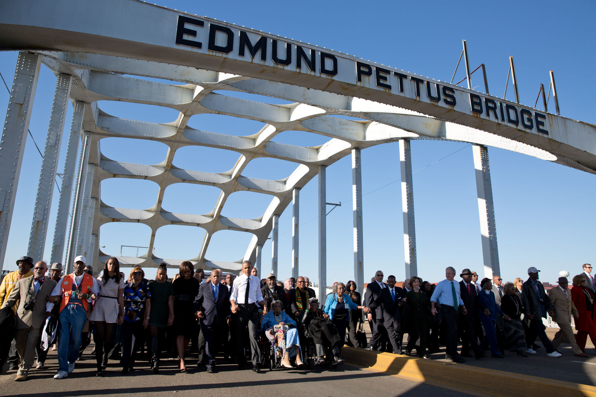 The First Family joins Rep. John Lewis, former President George W. Bush and former First Lady Laura Bush during a walk across Edmund Pettus Bridge