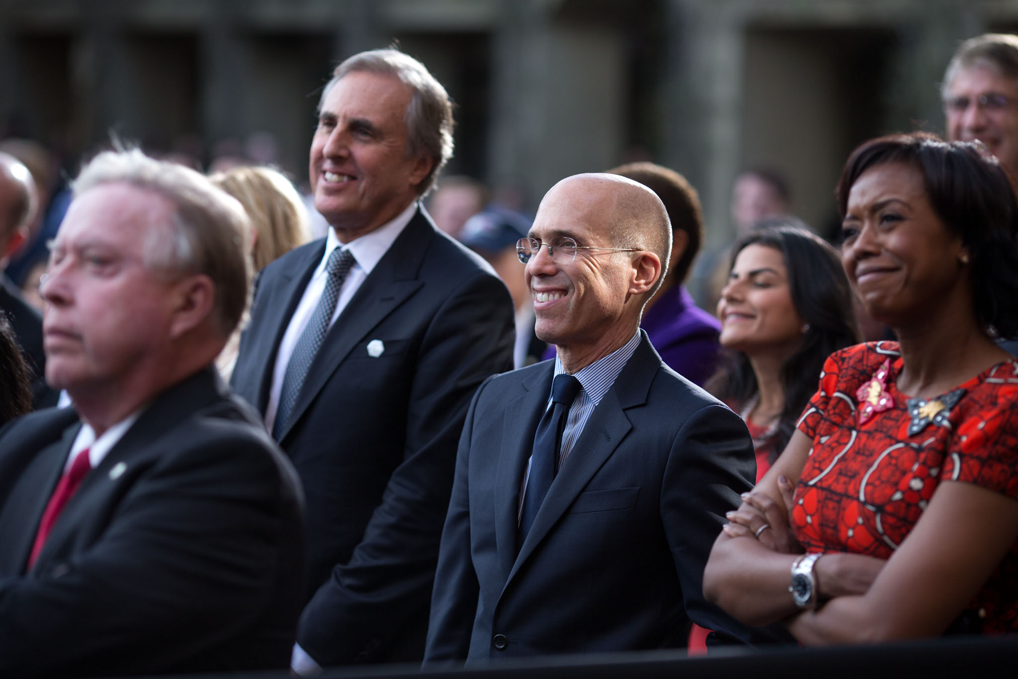 Jeffrey Katzenburg, third from left, listens with others as President Barack Obama delivers remarks on the economy to employees at the DreamWorks Animation SKG movie studio in Glendale, Calif., Nov. 26, 2013. Mellody Hobson is at right.
