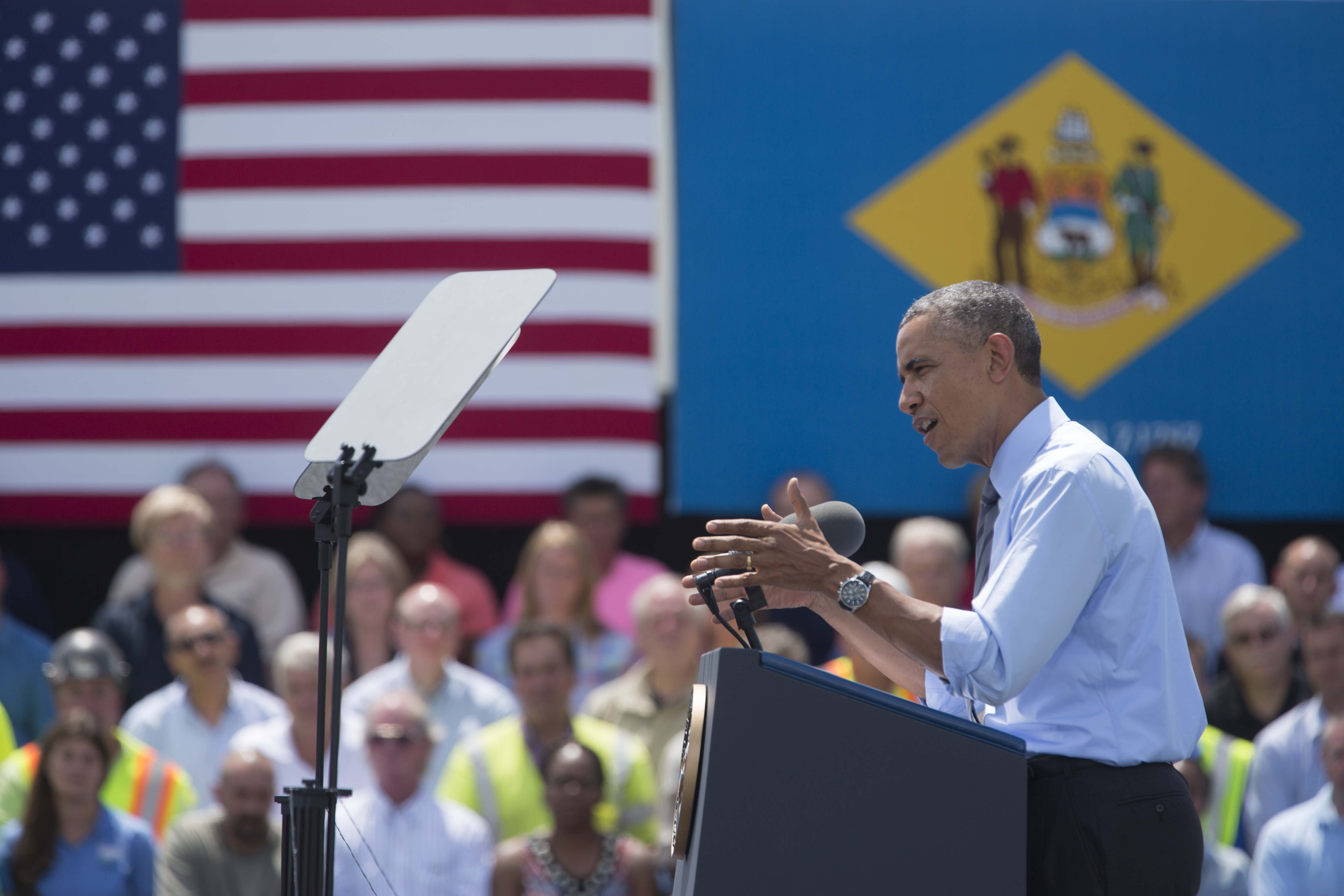 President Barack Obama delivers remarks near the Interstate 495 Bridge at the Port of Wilmington in Wilmington, Delaware