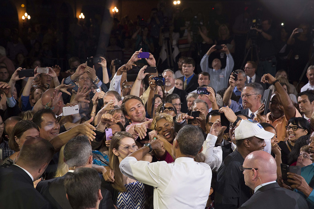President Barack Obama greets audience members after he delivered remarks on the economy at Uptown Theater
