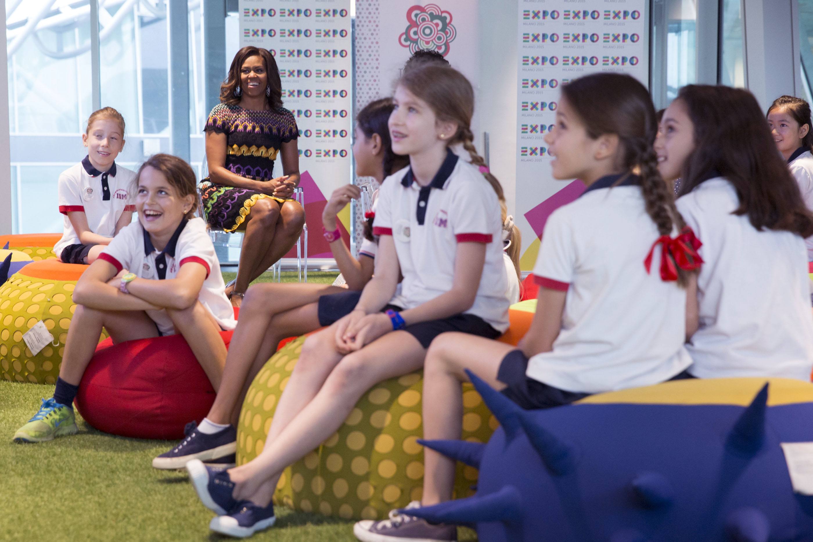 First Lady Michelle Obama watches food conservation videos at the World Expo in Milan