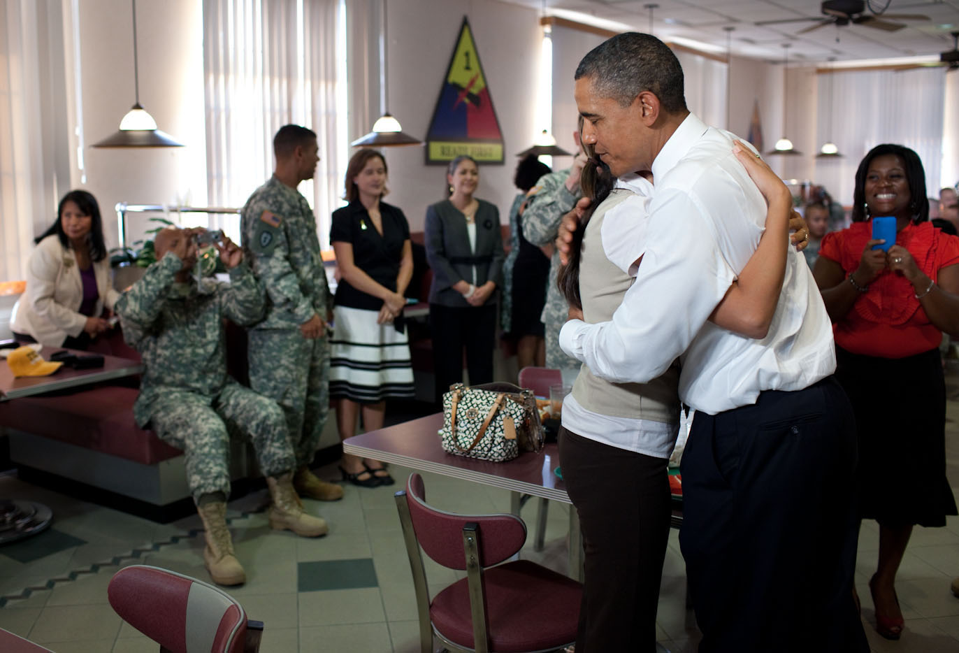 President Barack Obama Hugs a Woman as He Greets Members of the Military and Their Families at Fort Bliss in El Paso, Texas