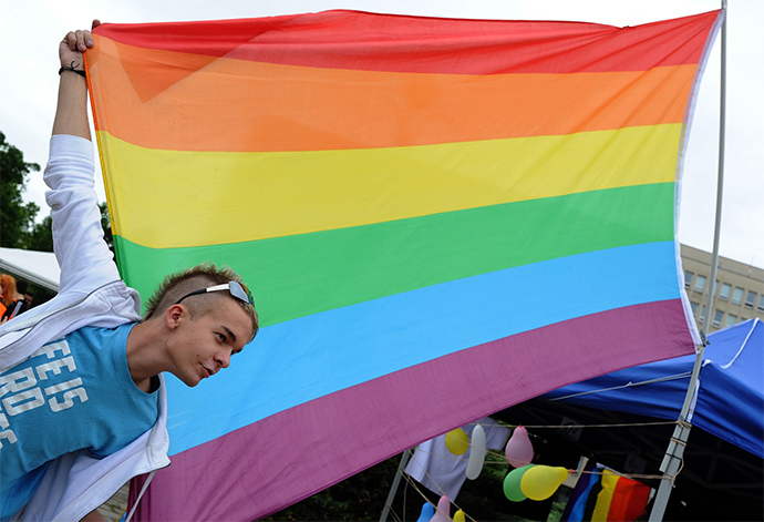 Demonstrator Holding Rainbow Flag in Bratislava