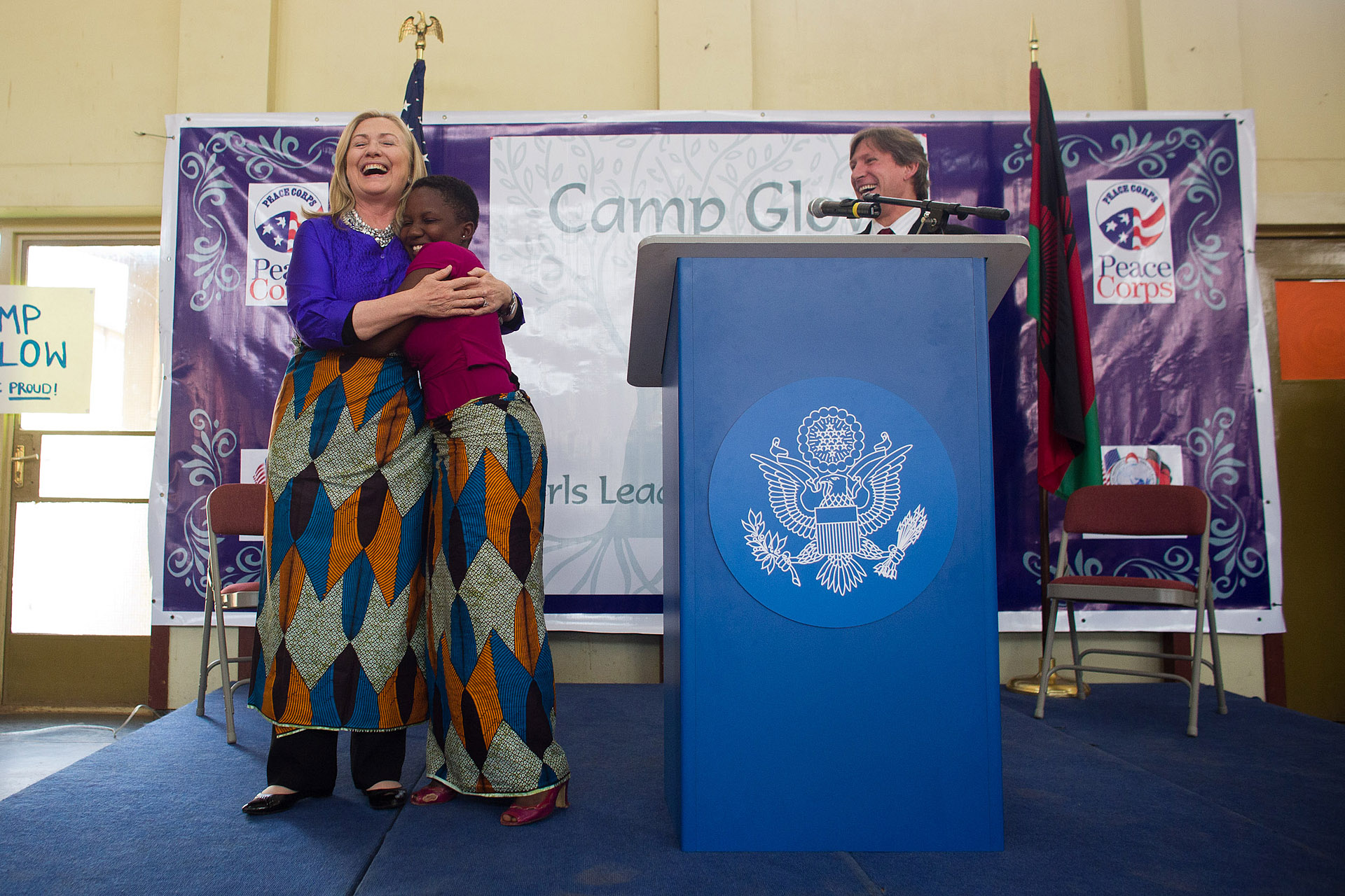 Secretary Clinton Hugs A Camp GLOW Kid
