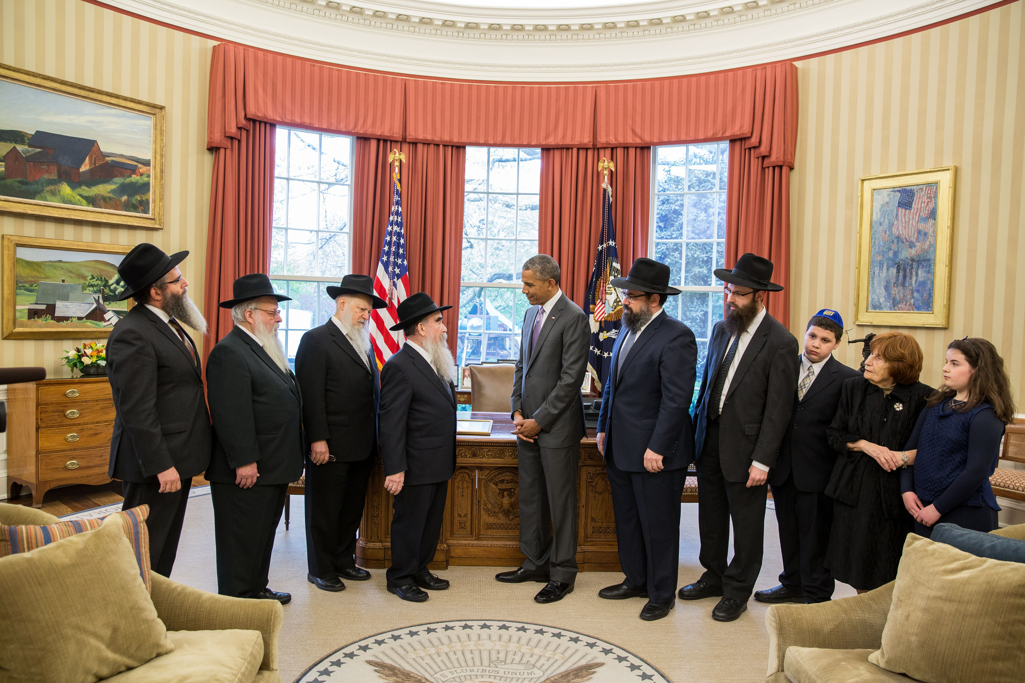 President Obama presents a ceremonial copy of the Education and Sharing Day Proclamation to a delegation from the American Friends of Lubavitch