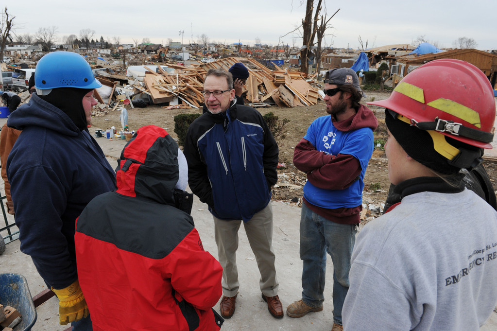 Rev. David Myers, Senior Advisor to the FEMA Administrator/Director Center of Faith-based & Neighborhood Partnerships, center, speaks