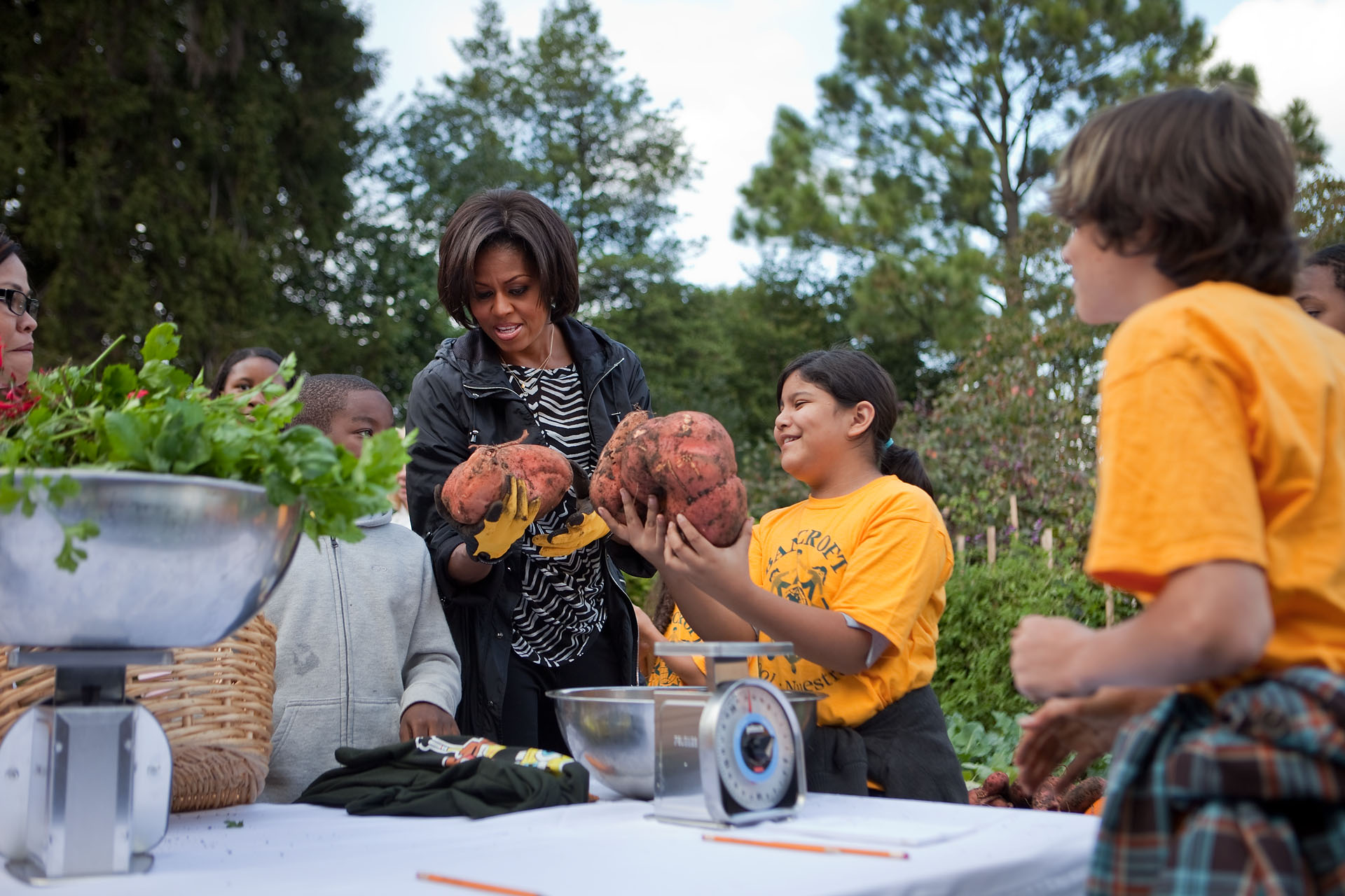 The First Lady Marvels at the Harvested Vegetables in the White House Garden