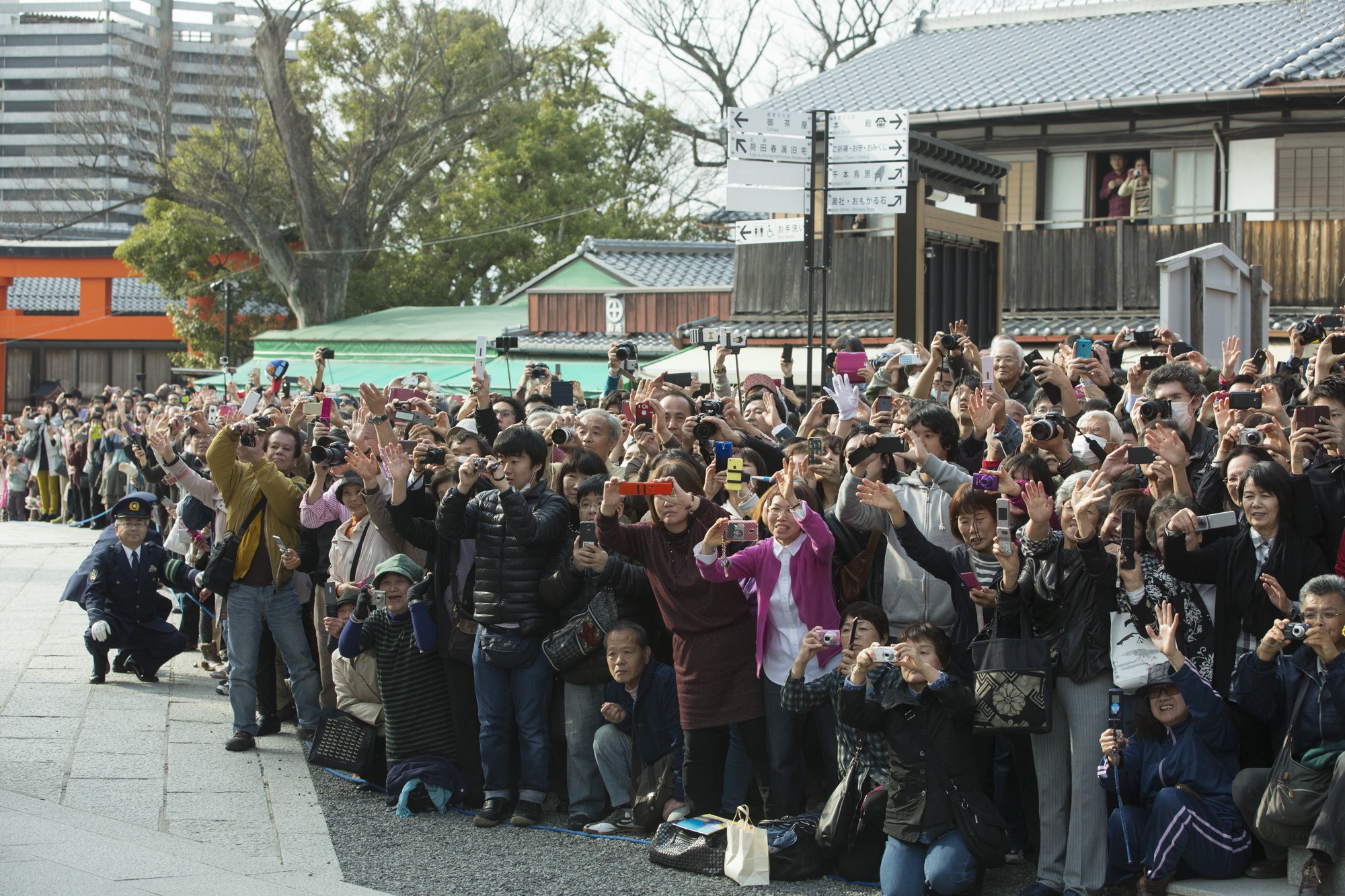 The Crowd Waves as First Lady Michelle Obama Departs the Fushimi Inari Shinto Shrine in Kyoto